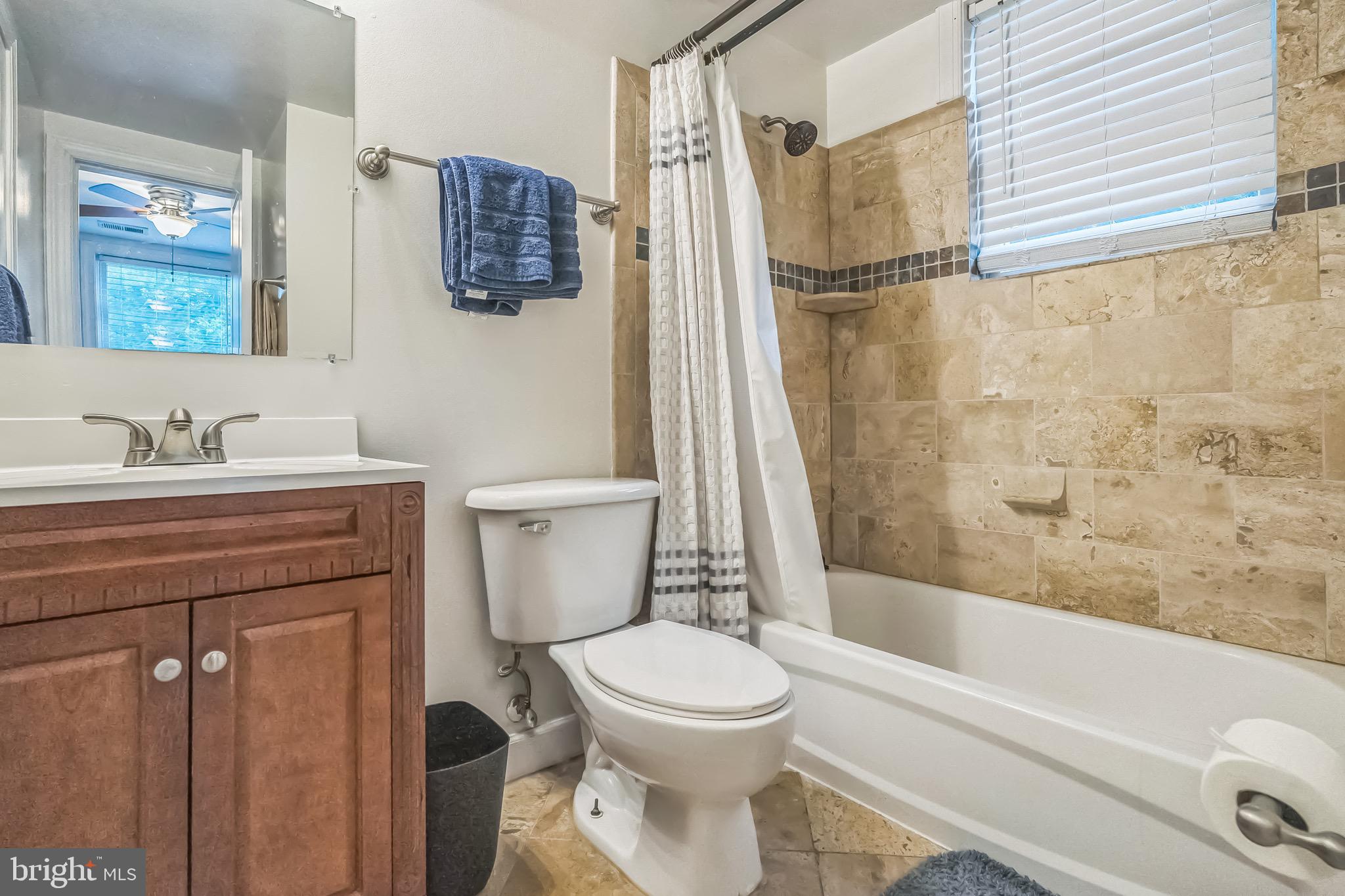 5040 1st Street Northwest, Unit 301 Washington, DC 20011 - Photo 10 of 22 a bathroom with a toilet sink and shower