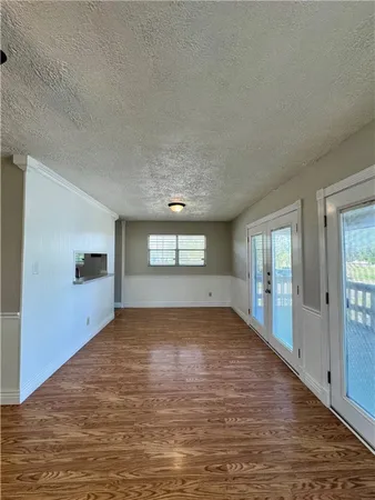 a view of hallway with wooden floor