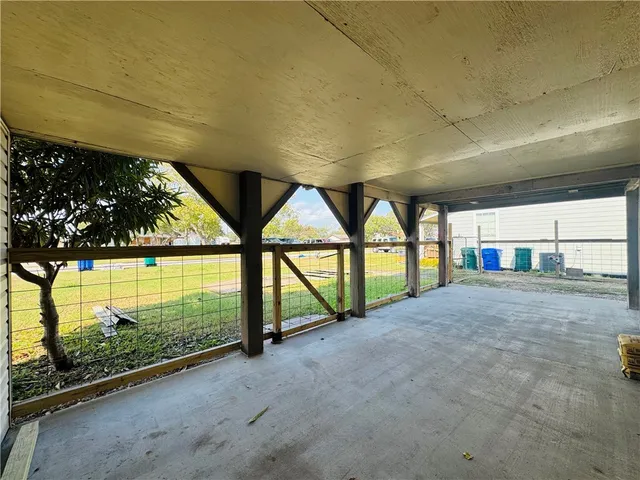 a view of an empty room with glass door