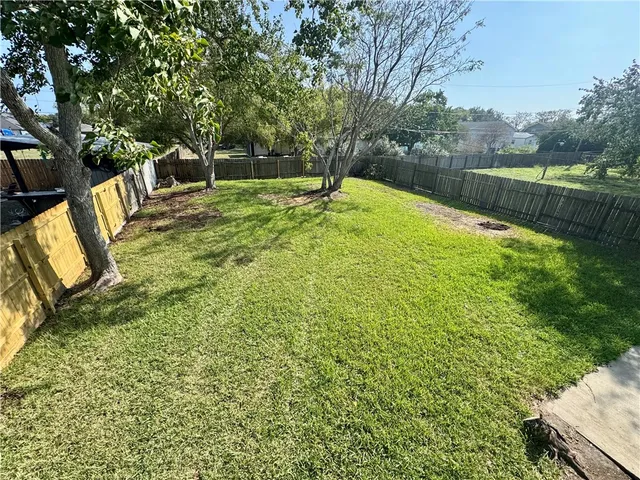 a swimming pool with outdoor seating and garden