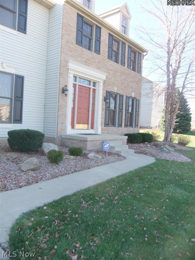3795 Stonebridge Boulevard Akron, OH 44321 - Photo 2 of 24 The landscaped front entrance leads you into...