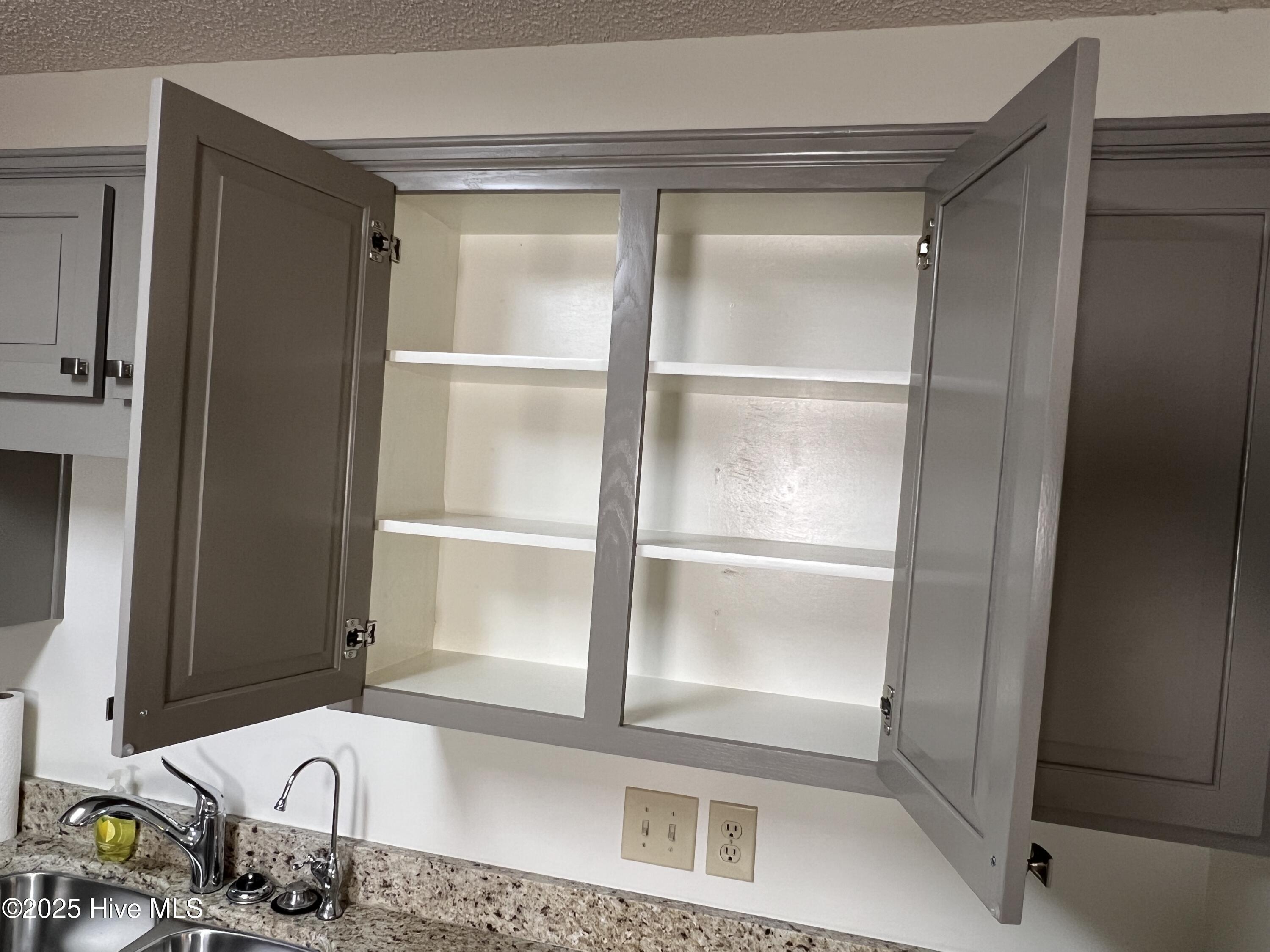 10 Pier Pointe, Unit POINTE New Bern, NC 28562 - Photo 10 of 64 white cabinet interior