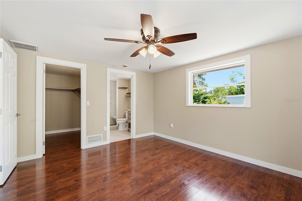 5984 Diana Road Venice, FL 34293 - Photo 21 of 36 wooden floor in an empty room with a window