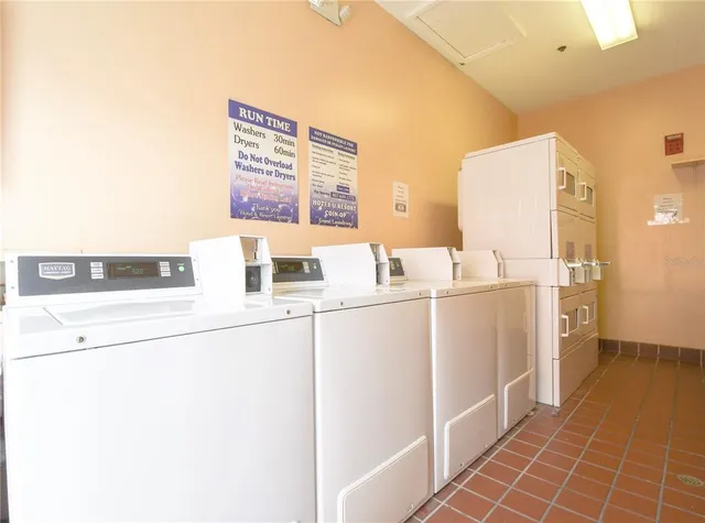 a room with a washing machine and sink