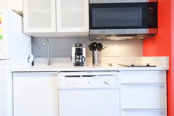 a kitchen with a sink and cabinets