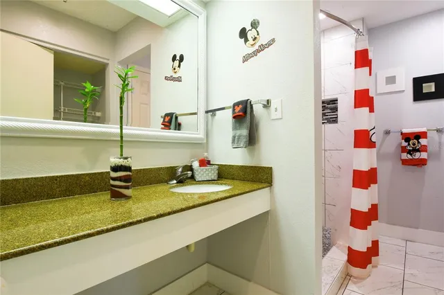 a bathroom with a sink and a mirror