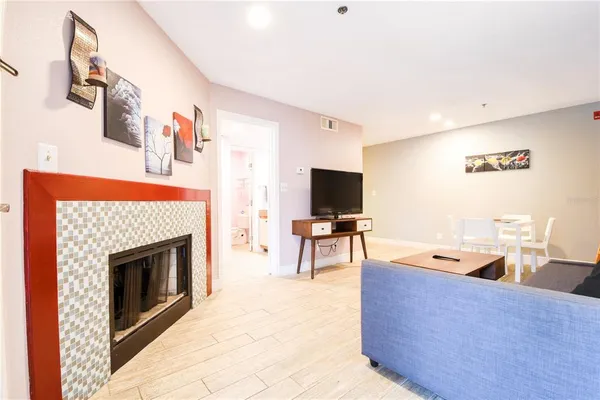 a living room with furniture and a fireplace