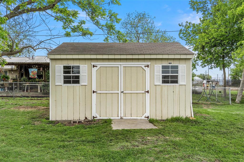 731 Highway 320 Lott, TX 76656 - Photo 13 of 16 a front view of a house with a yard