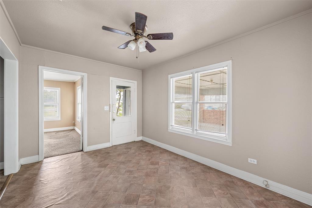 731 Highway 320 Lott, TX 76656 - Photo 3 of 16 an empty room that has a window