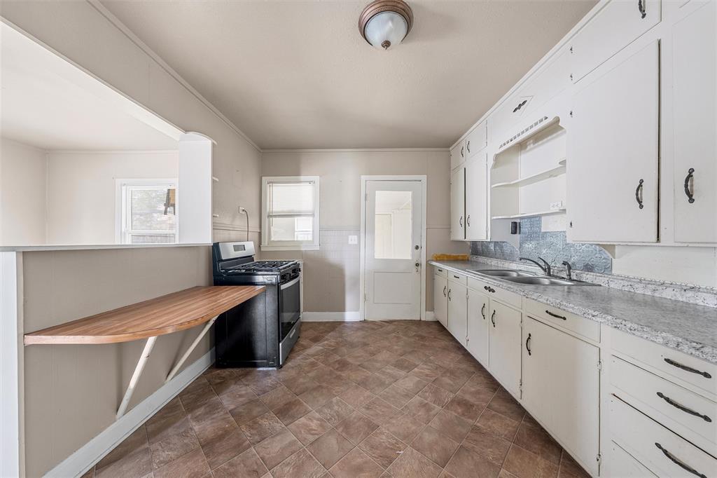 731 Highway 320 Lott, TX 76656 - Photo 5 of 16 a large kitchen with a stove top oven