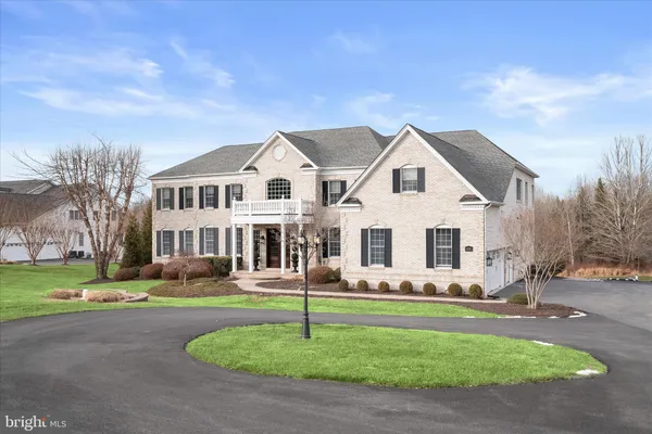 a living room with furniture and large windows
