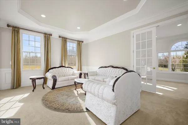 a view of a dining room with furniture and window