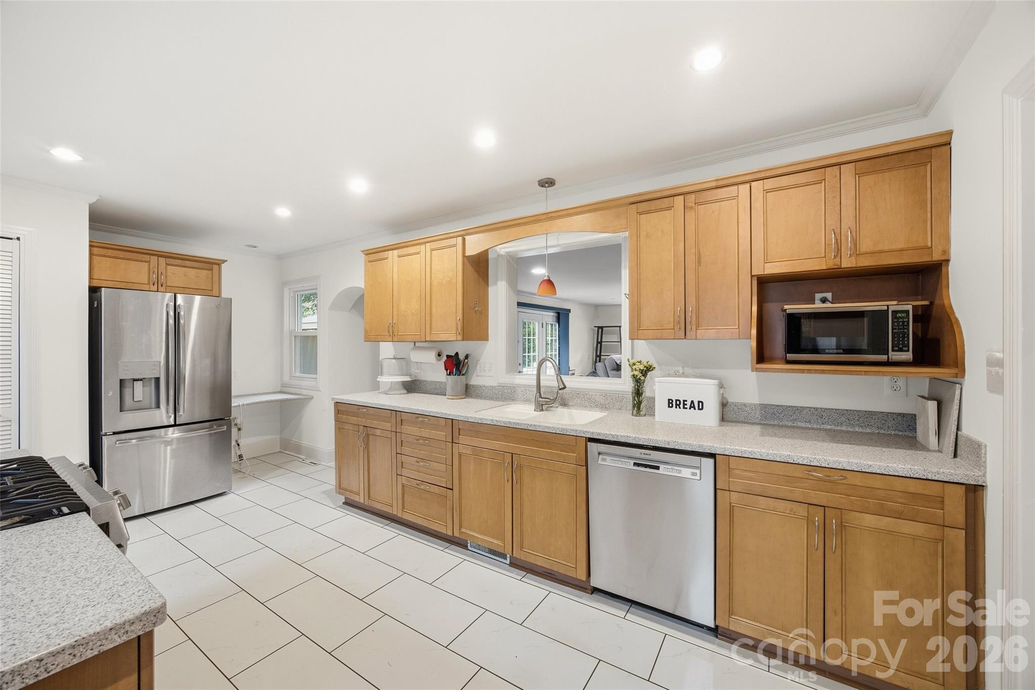 850 Burnley Road Charlotte, NC 28210 - Photo 11 of 38 a kitchen with stainless steel appliances granite countertop a refrigerator and a stove top oven