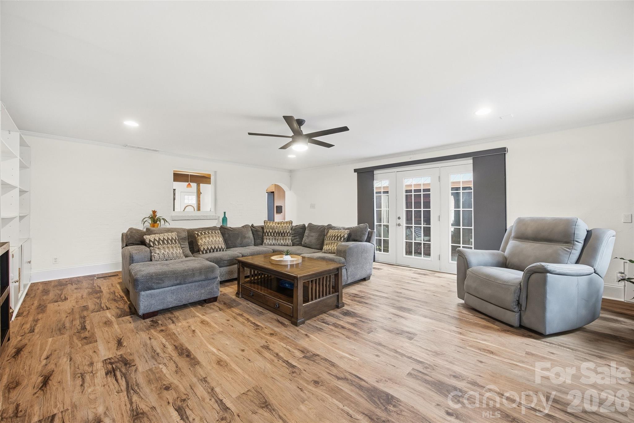 850 Burnley Road Charlotte, NC 28210 - Photo 12 of 38 a living room with furniture and a wooden floor