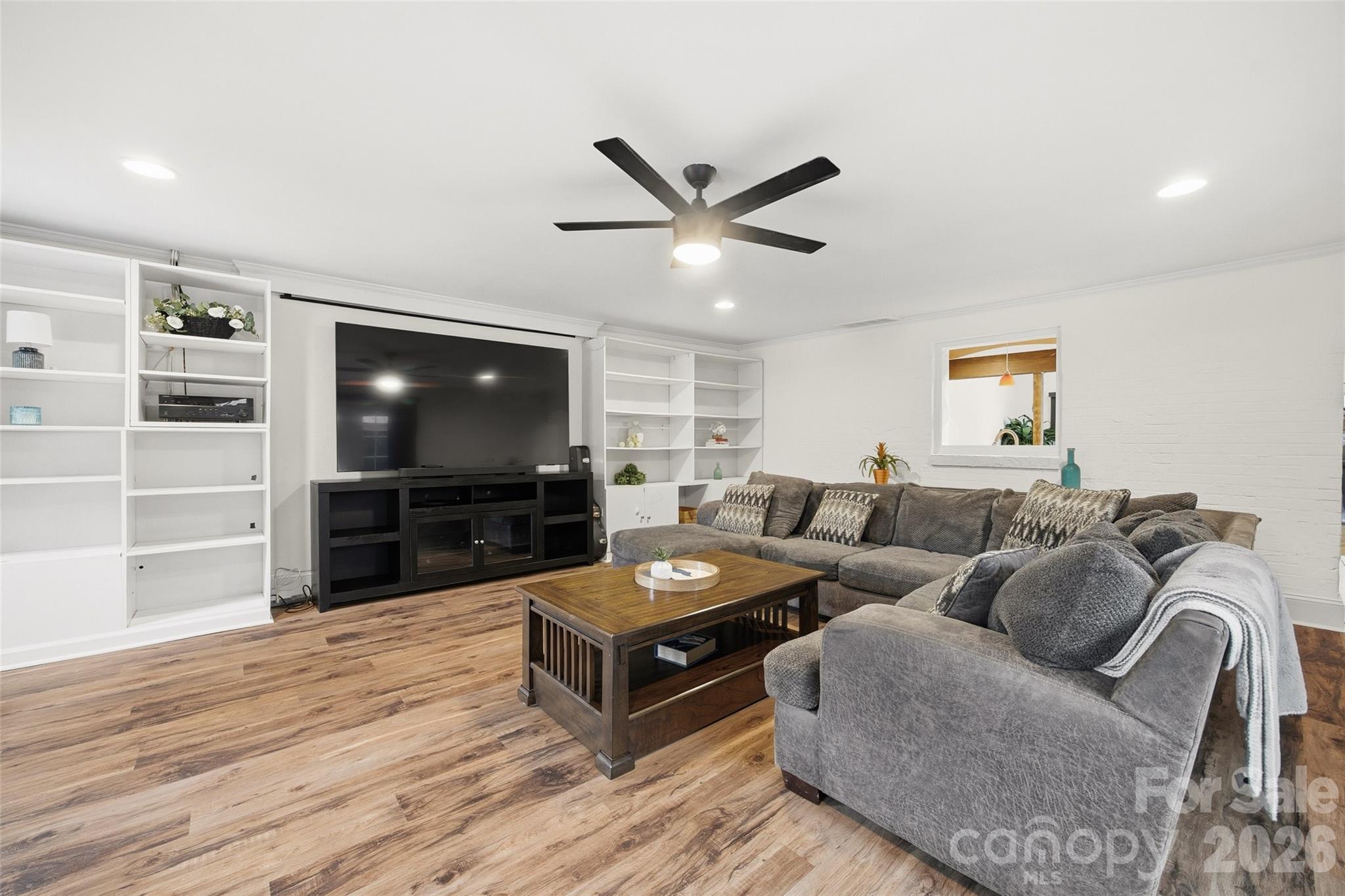 850 Burnley Road Charlotte, NC 28210 - Photo 13 of 38 a living room with furniture and a flat screen tv