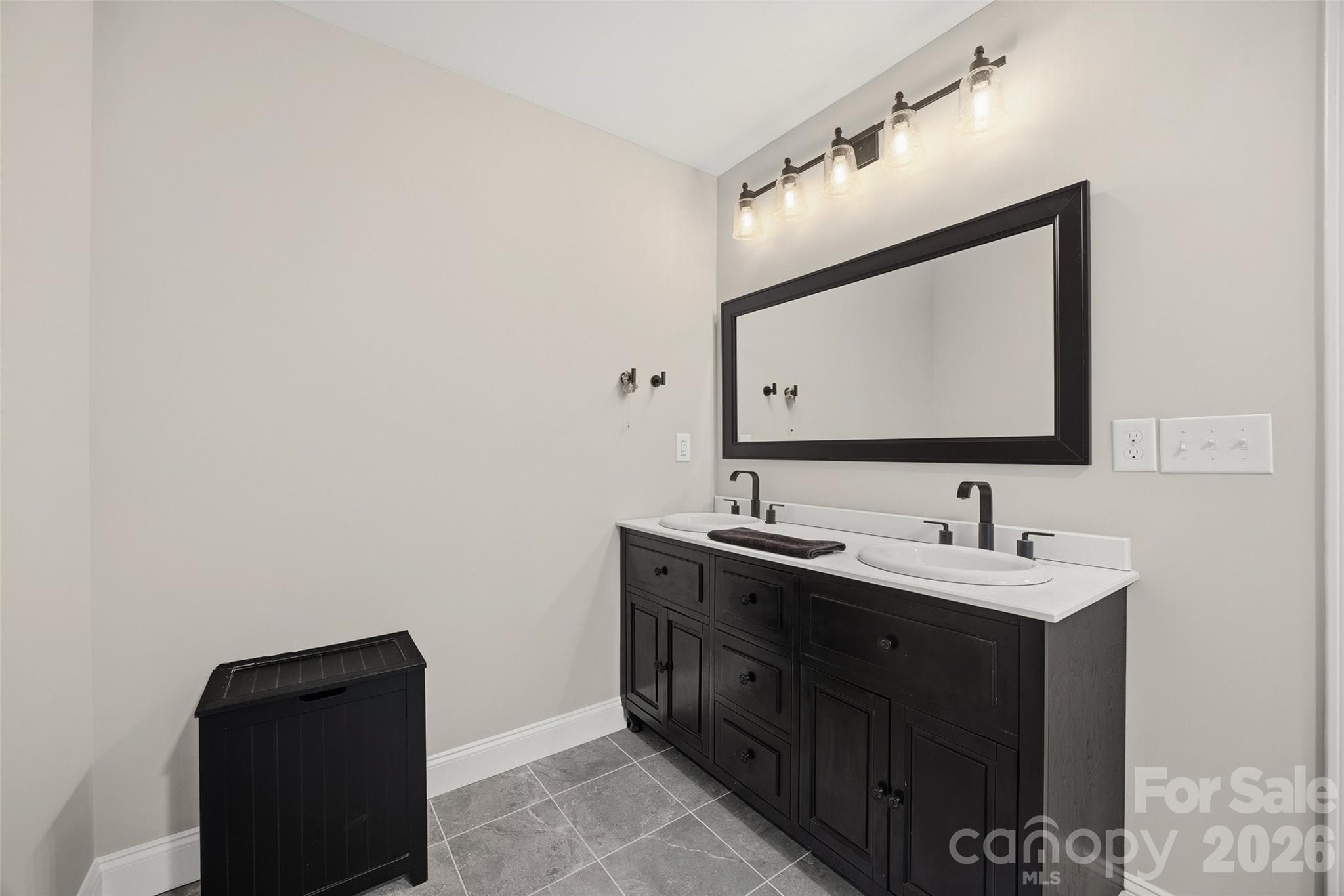 850 Burnley Road Charlotte, NC 28210 - Photo 15 of 38 a bathroom with a sink and a mirror