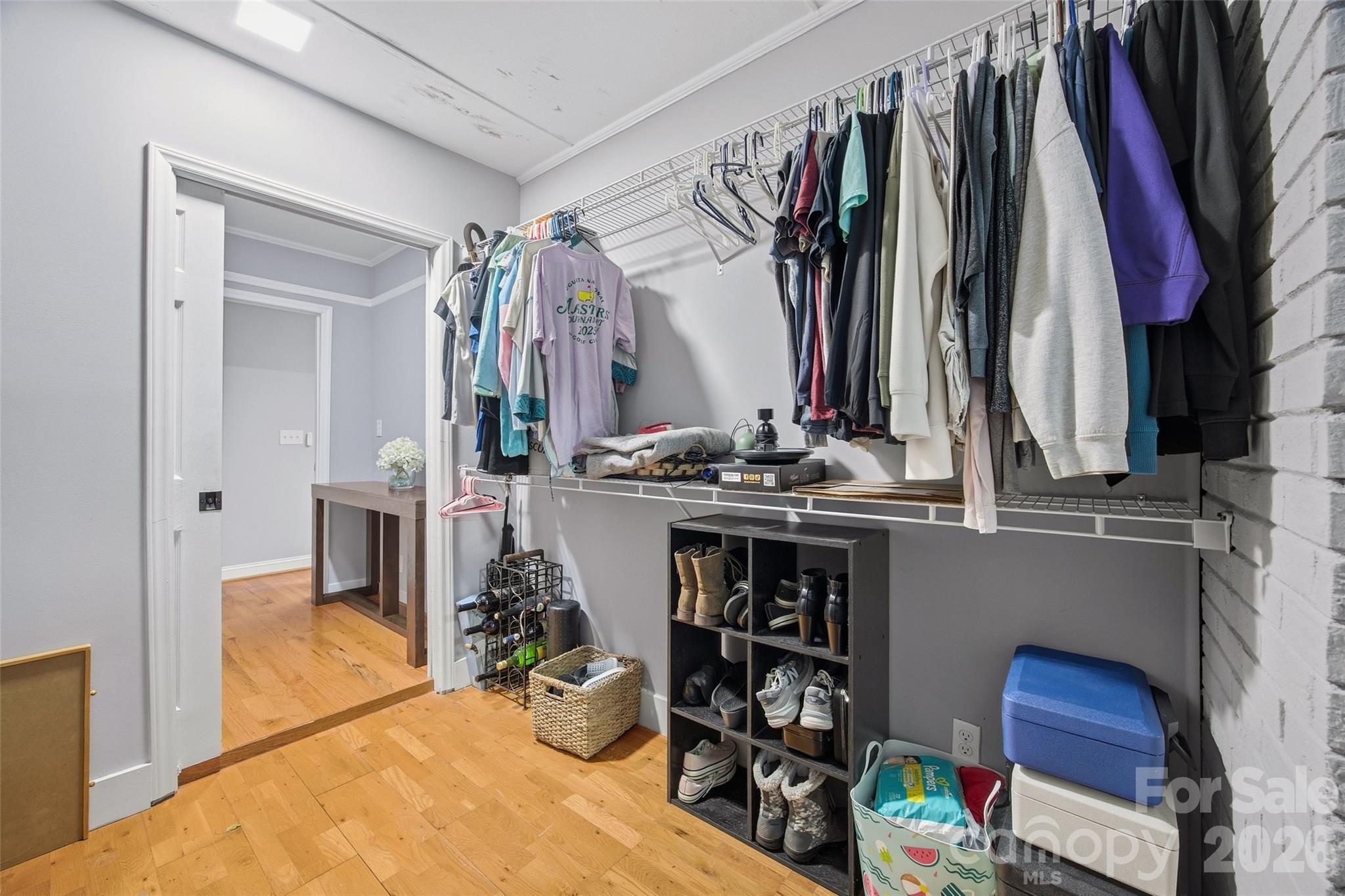 850 Burnley Road Charlotte, NC 28210 - Photo 18 of 38 a view of walk in closet with clothes and shoes