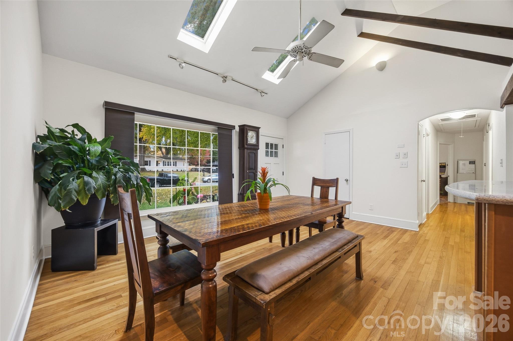 850 Burnley Road Charlotte, NC 28210 - Photo 8 of 38 a view of a dining room with furniture and a potted plant