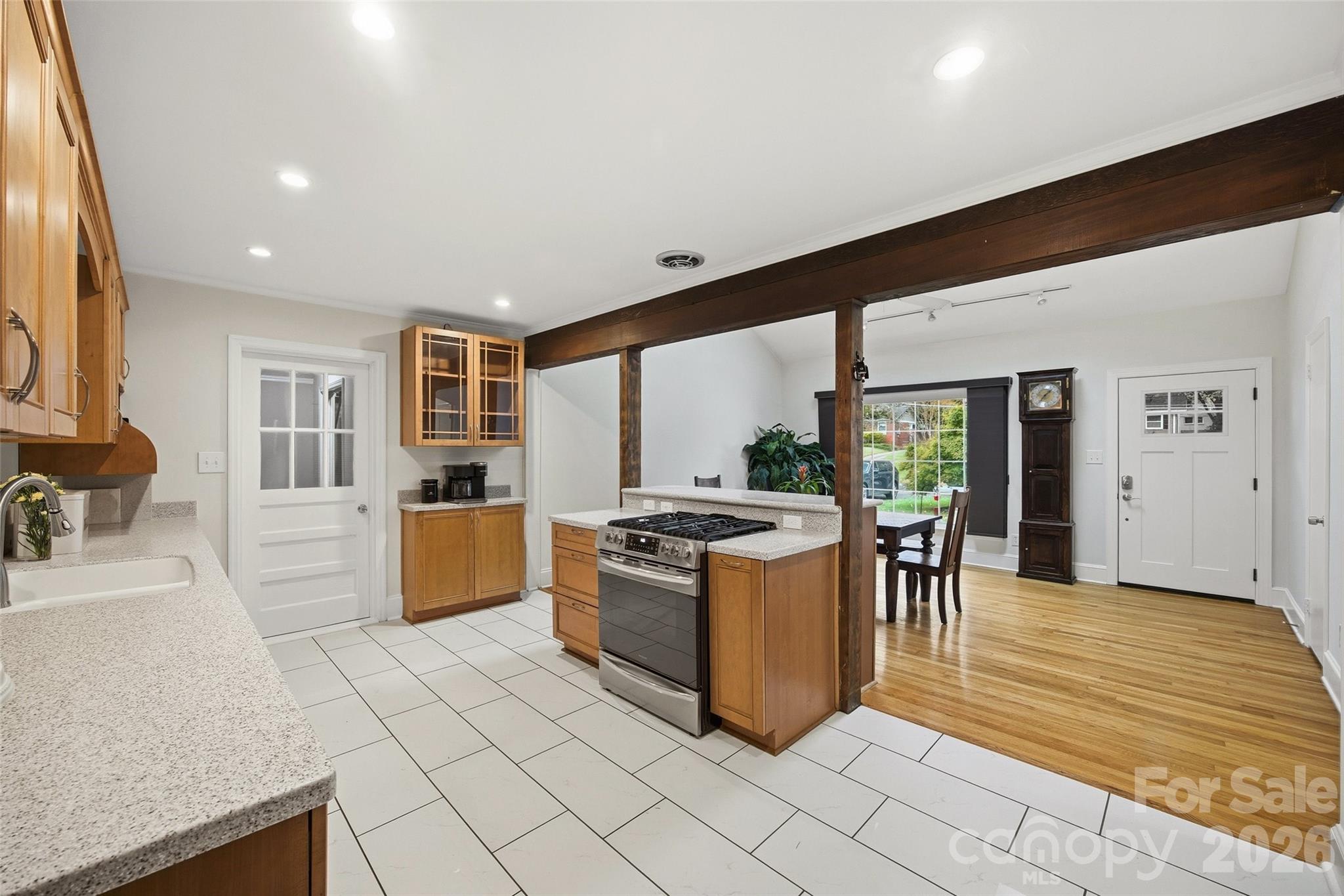 850 Burnley Road Charlotte, NC 28210 - Photo 10 of 38 a kitchen with stainless steel appliances granite countertop a stove and a sink