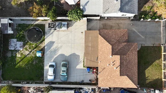 an aerial view of a house with swimming pool