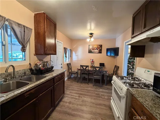 a kitchen with lots of counter top space and stainless steel appliances