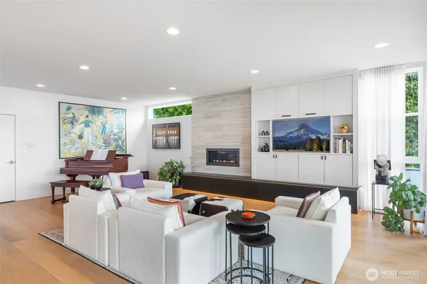 a large kitchen with kitchen island a large counter top space a sink stainless steel appliances and cabinets