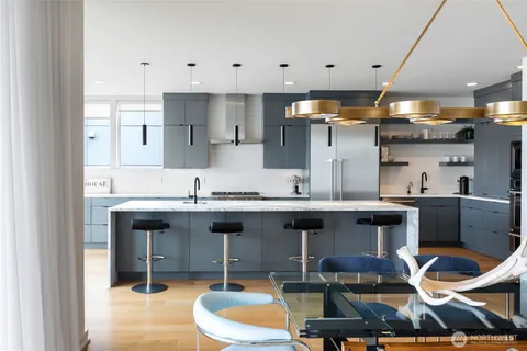 a bathroom with a bathtub a sink and a mirror