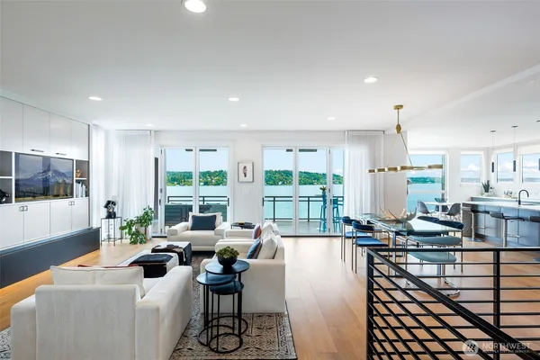 a living room with furniture and large windows