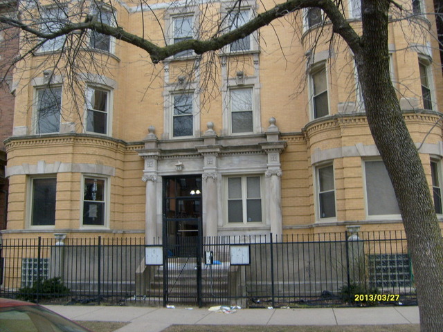 4810 South Prairie Avenue, Unit 2N Chicago, IL 60615 - Photo 1 of 15 a front view of a house with a iron gate