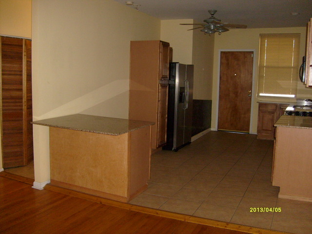 4810 South Prairie Avenue, Unit 2N Chicago, IL 60615 - Photo 14 of 15 an empty room with wooden floor