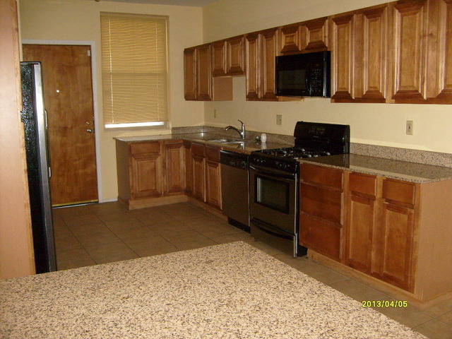 4810 South Prairie Avenue, Unit 2N Chicago, IL 60615 - Photo 15 of 15 a kitchen with stainless steel appliances granite countertop a stove a sink and a refrigerator