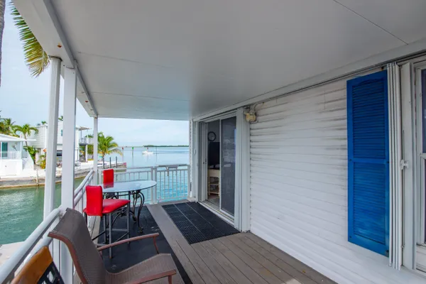 a view of a balcony with furniture