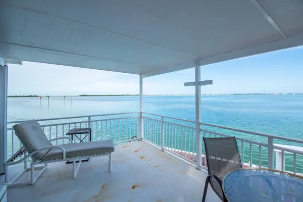 a front view of a house with a sitting area