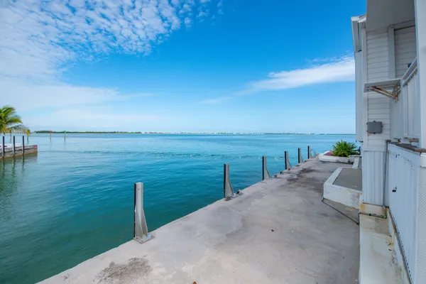 a terrace with outdoor seating and trees