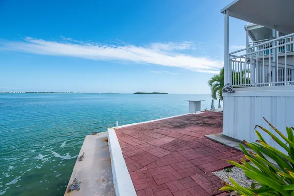a small pool with a table and chairs