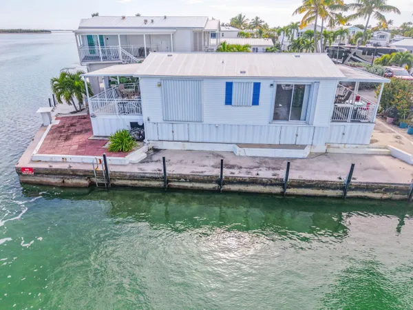 an aerial view of a house with outdoor space