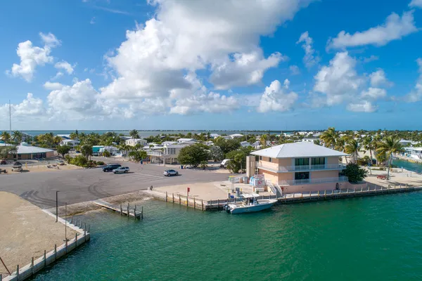 a view of a chairs and table in backyard