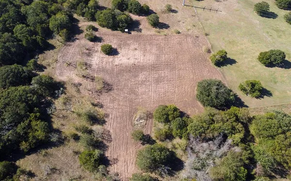 an aerial view of residential house with outdoor space