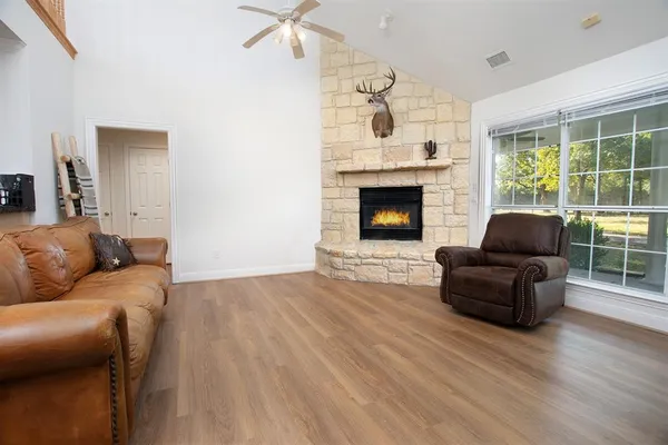 a living room with furniture and a fireplace