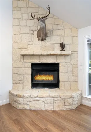 a fireplace with a vase on top of it