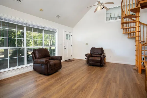 a living room with furniture and a window