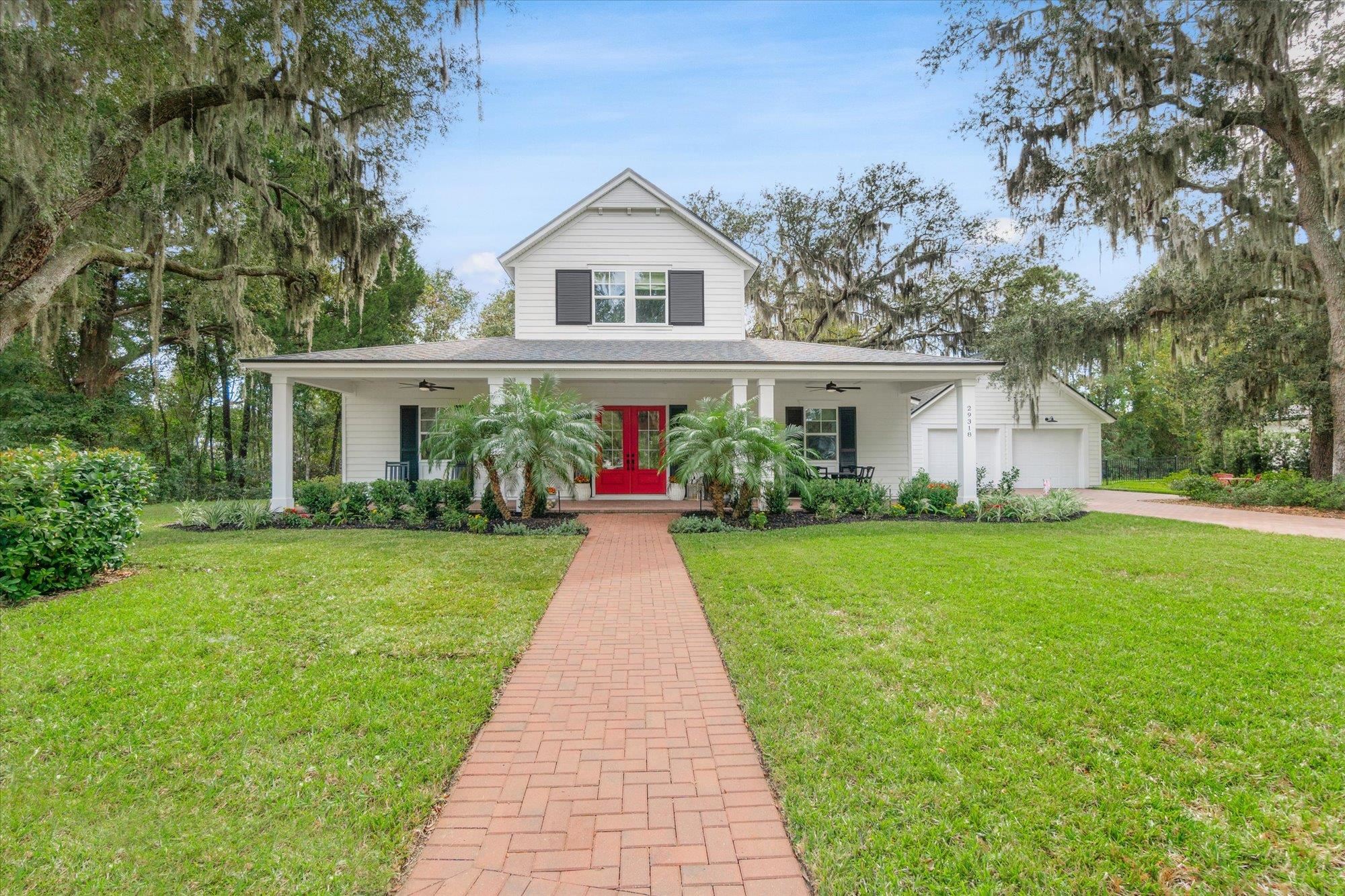 a front view of house with yard and green space