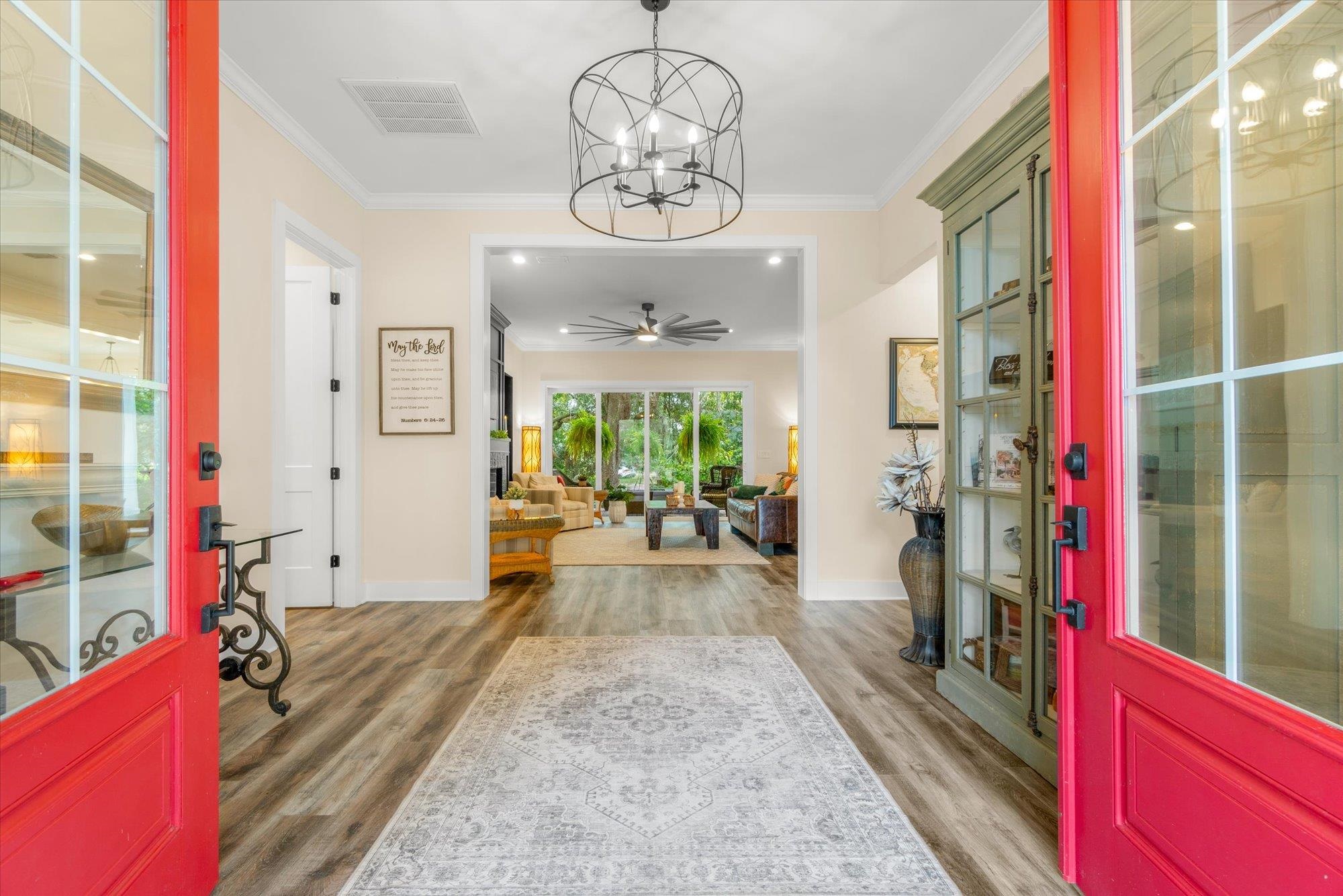 29318 Grandview Manor Yulee, FL 32097 - Photo 11 of 68 Entryway featuring crown molding, a chandelier, light wood finished floors, and a ceiling fan