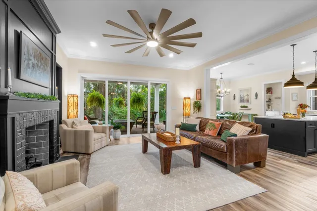 a kitchen with stainless steel appliances granite countertop a stove and a wooden floors