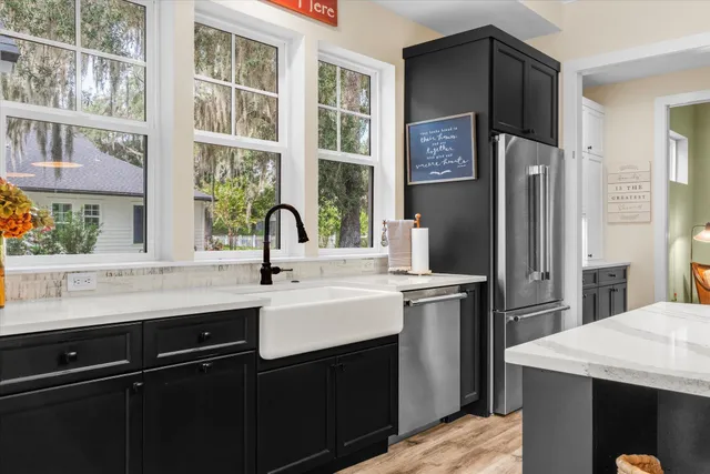 a bed room with furniture and a flat screen tv