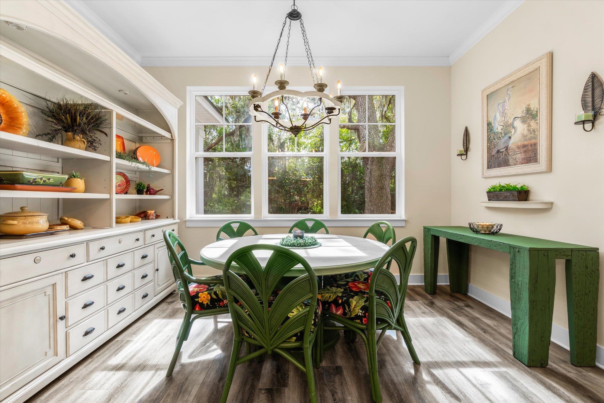 29318 Grandview Manor Yulee, FL 32097 - Photo 24 of 68 a dining room with furniture a chandelier and wooden floor