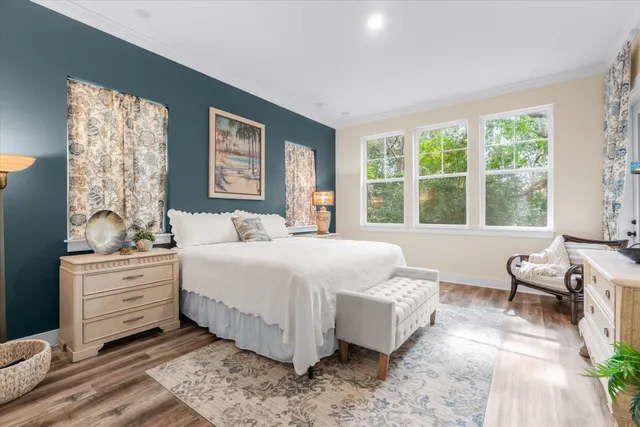a view of hallway with wooden floor