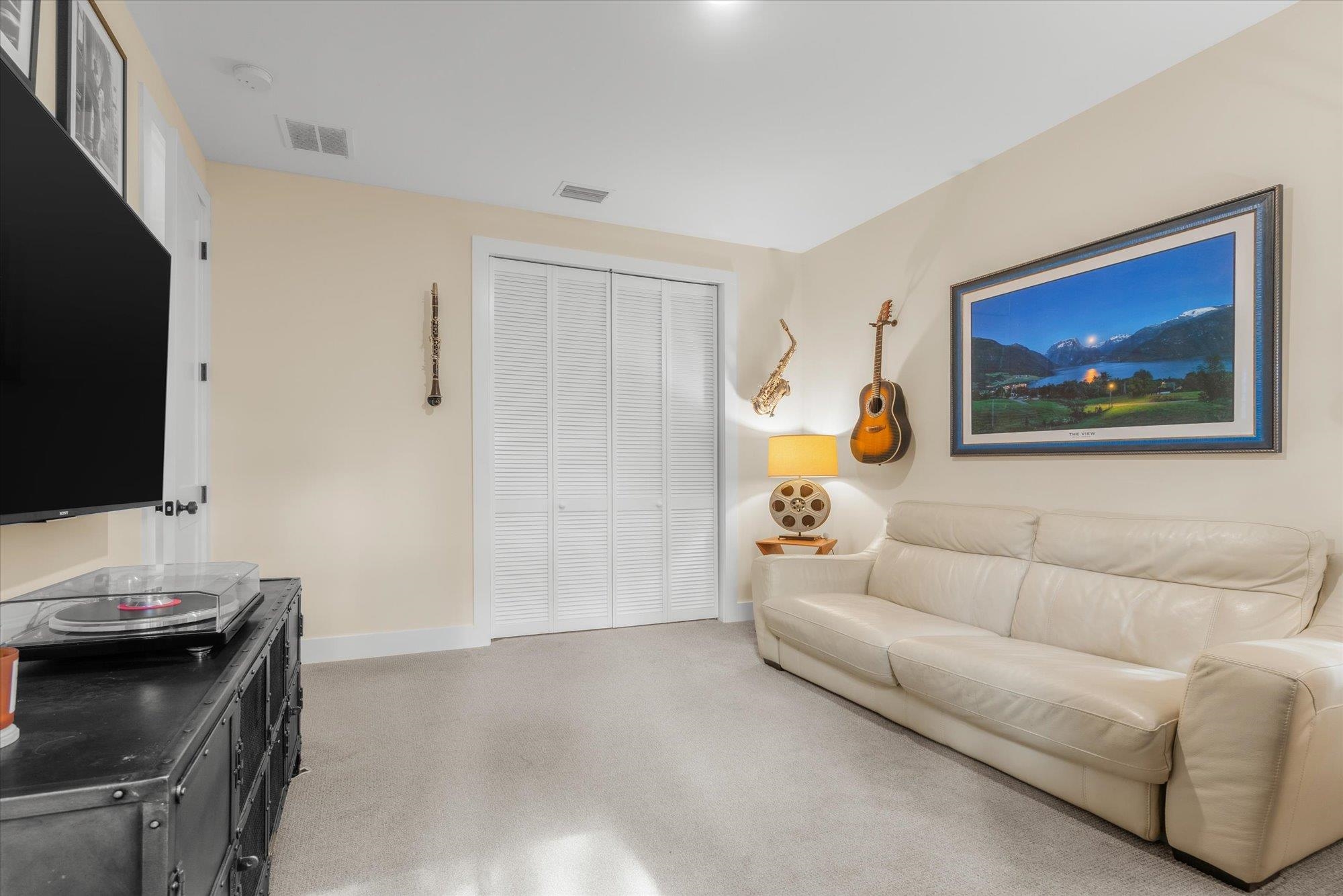 29318 Grandview Manor Yulee, FL 32097 - Photo 37 of 68 a living room with furniture and a flat screen tv