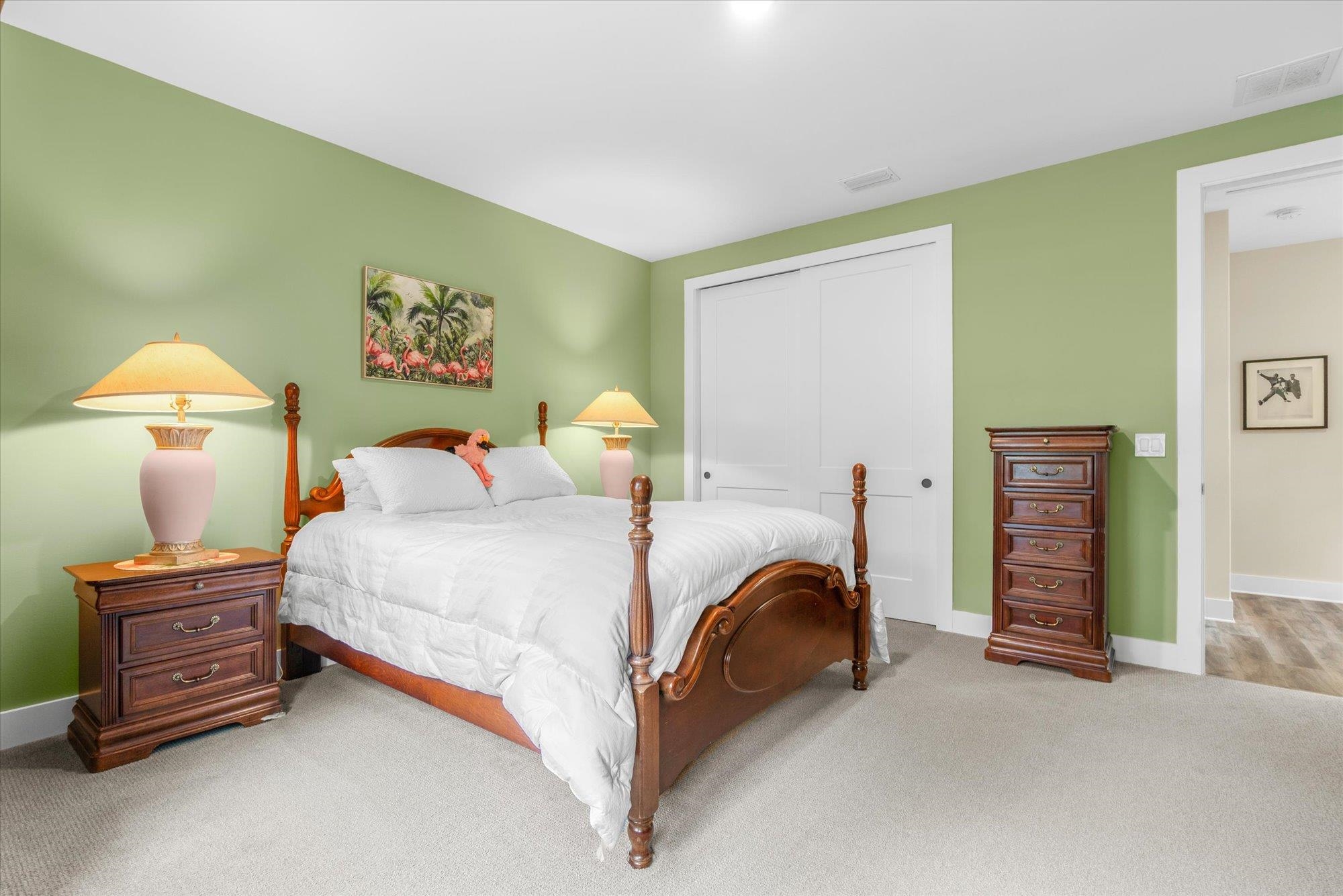 29318 Grandview Manor Yulee, FL 32097 - Photo 41 of 68 a bedroom with a bed and a lamp on a dresser