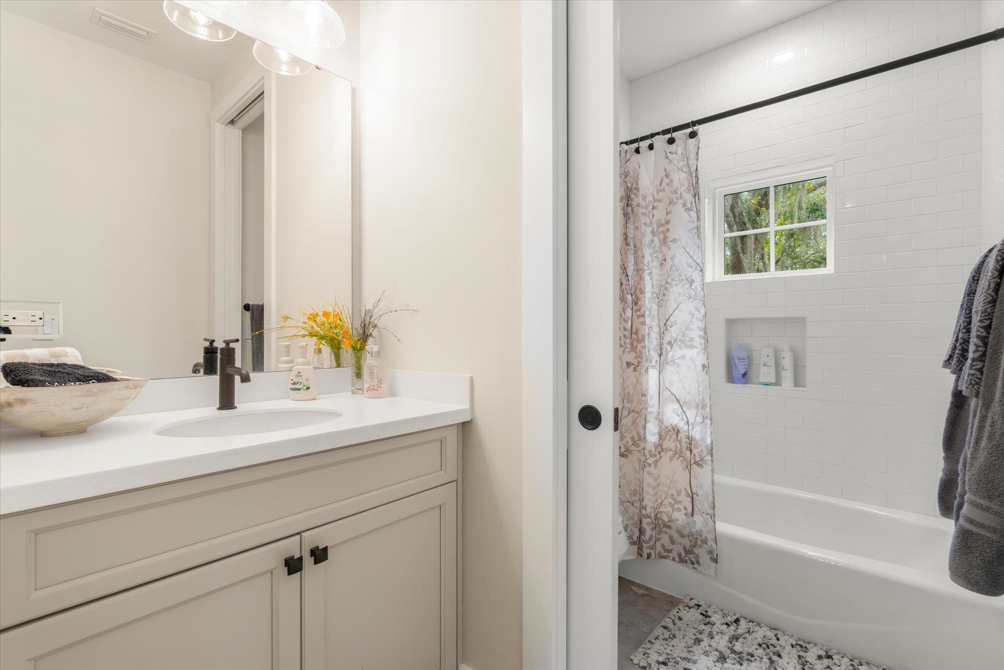 29318 Grandview Manor Yulee, FL 32097 - Photo 42 of 68 a bathroom with a sink a bathtub and a shower